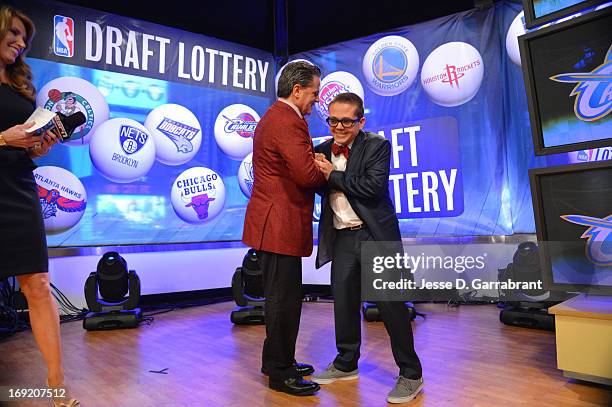 Owner Dan Gilbert congratulates his son Nick Gilbert of the Cleveland Cavaliers after winning the overall number one pick during the 2013 NBA Draft...