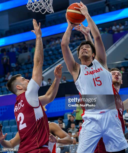 Masato of Japan in action against TALLA Gueye of Qatar in action during the Men's Basketball Preliminary Round Group D match between Japan and Qatar...
