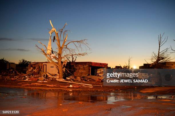 Tornado-devastated neighbourhood is pictured on late May 21, 2013 in Moore, Oklahoma. Families returned to a blasted moonscape that had been an...