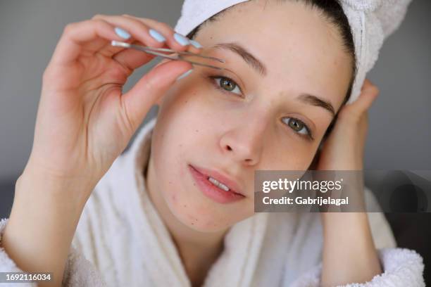 beautification woman- concept stock photo - eyebrow tweezers imagens e fotografias de stock