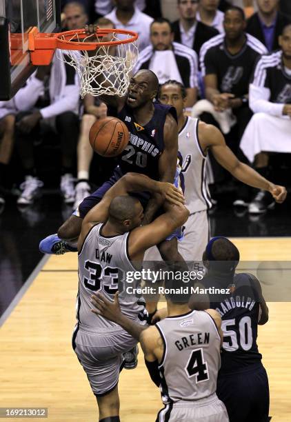 Quincy Pondexter of the Memphis Grizzlies dunks in the fourth quarter against Boris Diaw of the San Antonio Spurs during Game Two of the Western...