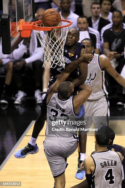 Quincy Pondexter of the Memphis Grizzlies dunks in the fourth quarter against Boris Diaw of the San Antonio Spurs during Game Two of the Western...