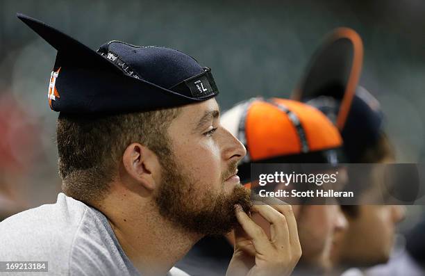 Fans of the Houston Astros watch the play during the ninth inning against the Kansas City Royals at Minute Maid Park on May 21, 2013 in Houston,...