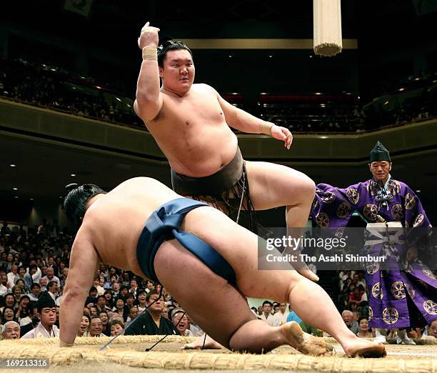 Mongolian Yokozuna, sumo's grand champion Hakuho , whose real name is Mnkhbatyn Davaajargal throws Goeido to win during day ten of the Grand Sumo...