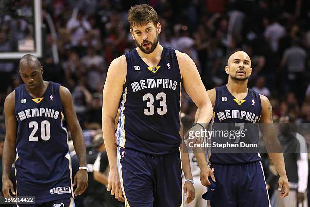 Quincy Pondexter, Marc Gasol and Jerryd Bayless of the Memphis Grizzlies react dejected after they lost in overtime 93-89 against the San Antonio...