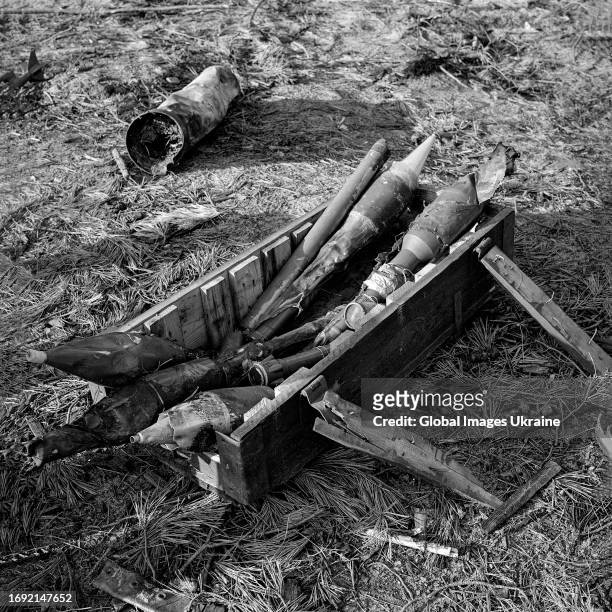 Burnt anti-tank shells from the Soviet RPG-7 grenade launcher lie on abandoned Russian positions on April 14, 2022 in Sosnivka Village, Kyiv Oblast,...