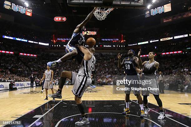 Quincy Pondexter of the Memphis Grizzlies dunks over Boris Diaw of the San Antonio Spurs in the fourth quarter during Game Two of the Western...