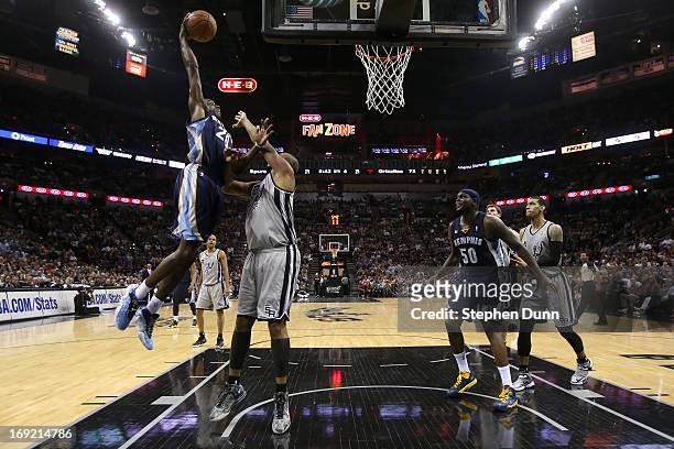 Quincy Pondexter of the Memphis Grizzlies dunks over Boris Diaw of the San Antonio Spurs in the fourth quarter during Game Two of the Western...