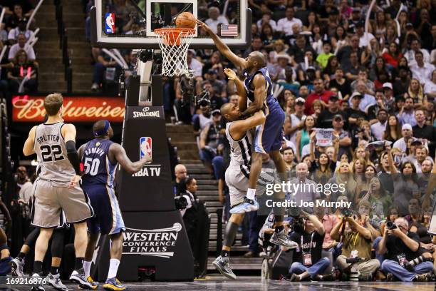 Quincy Pondexter of the Memphis Grizzlies dunks late in the fourth quarter against Boris Diaw of the San Antonio Spurs in Game Two of the Western...