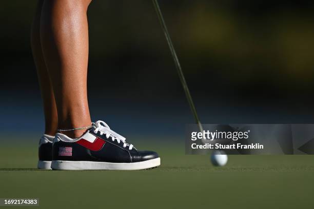 The stars and stripes flag is pictured on the shoes of Dannielle Kang of Team USA during practice prior to the The Solheim Cup at Finca Cortesin Golf...