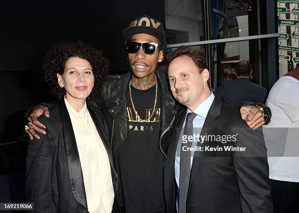 Universal Pictures Co- Chairman Donna Langley, rapper Wiz Khalifa and Universal Music publishing president Mike Knobloch arrive at the premiere of...