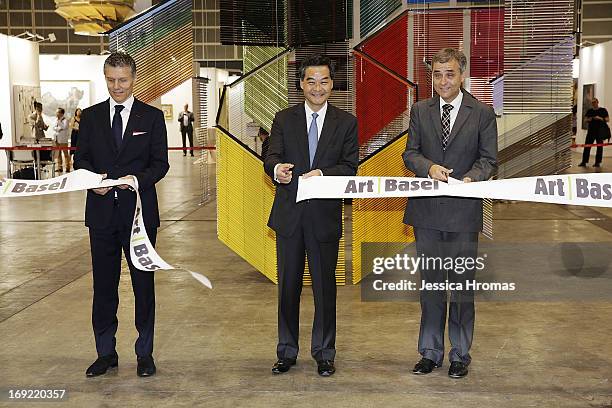 The Hon CY Leung, Chief Executive of the Hong Kong Special Administrative Region is accompanied by , Rene Kamm, CEO, MCH Basel Exhibition, and Guy...