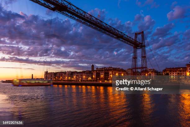 vizcaya bridge in portugalete spain at dusk - hanging bridge stock pictures, royalty-free photos & images