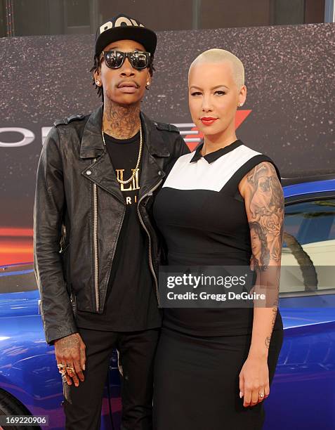 Rapper Wiz Khalifa and Amber Rose arrive at the Los Angeles premiere of "Fast & The Furious 6" at Gibson Amphitheatre on May 21, 2013 in Universal...