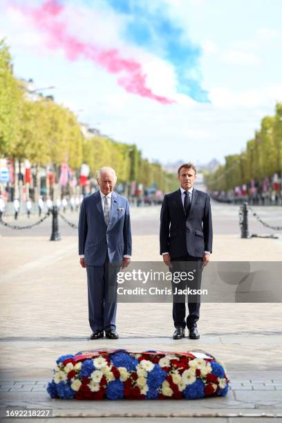 King Charles III and President of France, Emmanuel Macron stand in front of the Franco-British Wreath decorated with the ribbons of The King and the...