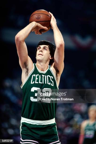 Kevin McHale of the Boston Celtics shoots a jump shot during the 1990 NBA game against the New Jersey Nets at the Brendan Byrne Arena in East...