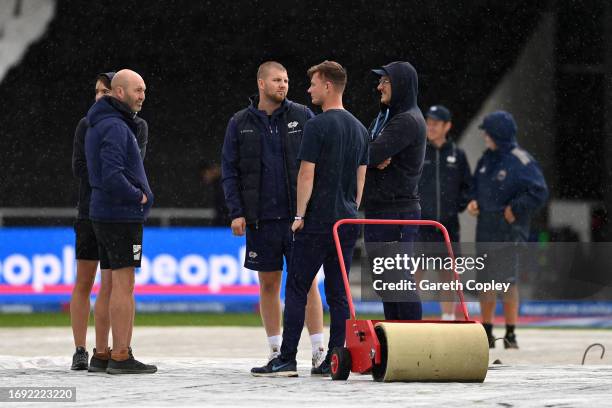 Groundstaff wait for the rain to stop as it delays the start of the 1st Metro Bank One Day International between England and Ireland at Headingley on...