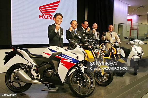 Thai-manufactured CBR125R and other overseas-built motorcycle models are displayed at a press preview in Tokyo on May 22, 2013. Honda Motor announced...