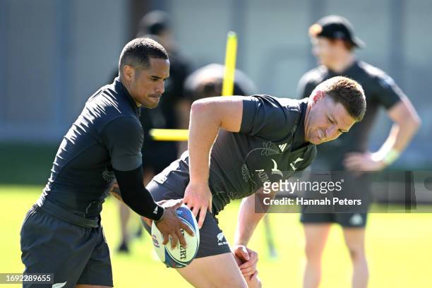 Aaron Smith and Jordie Barrett of the All Blacks run through drills during a New Zealand All Blacks training session at UBB Training ground on...