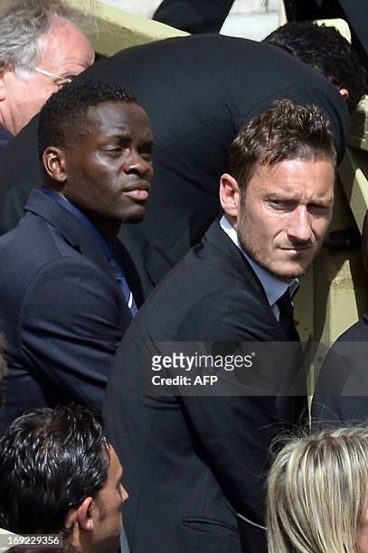 Roma's captain Francesco Totti and Lazio Rome's French striker Louis Saha attend Pope Francis' general audience in St Peter's square at the Vatican...