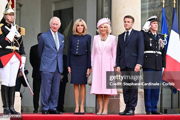 French President Emmanuel Macron with his wife Brigitte Macron and Britain's King Charles III and Queen Camilla arrive for a bilateral meeting at the...