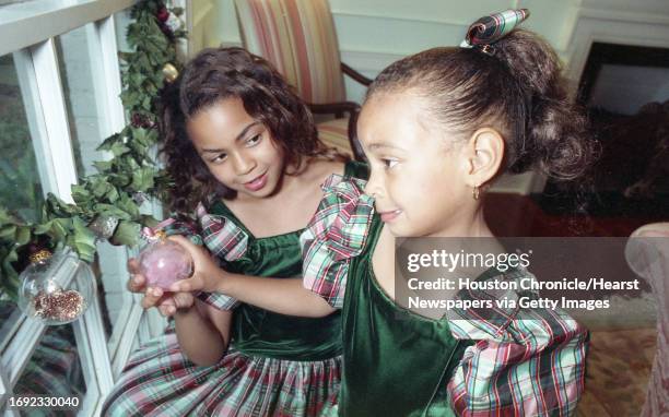 Family Christmas traditions. Tina & Matthew Knowles, with their two daughters, Beyonce and Solange. 10/23/90