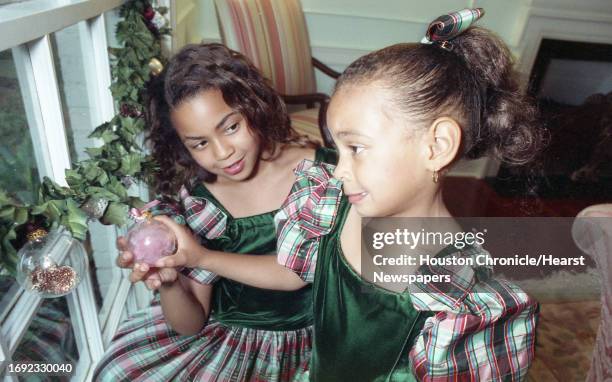 Family Christmas traditions. Tina & Matthew Knowles, with their two daughters, Beyonce and Solange. 10/23/90