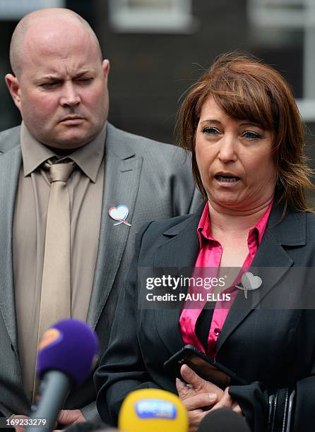 Denise Fergus stands with her husband Stuart as she speaks to the press after addressing a parole hearing for Jon Venables by video link from Crosby,...