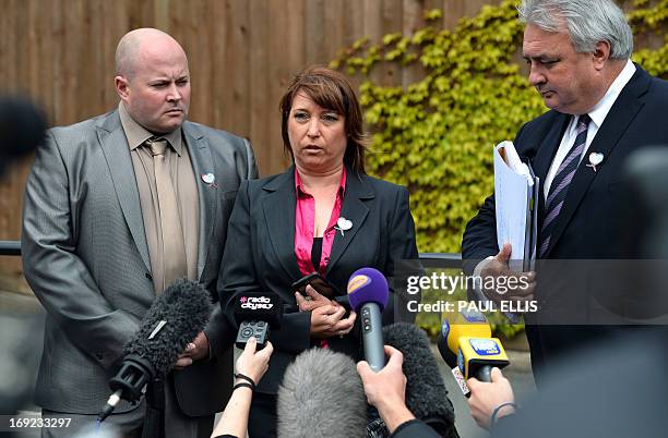 Denise Fergus stands with her husband Stuart and lawyer Sean Sexton as she speaks to the press after addressing a parole hearing for Jon Venables by...