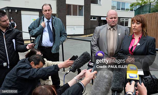 Denise Fergus stands with her husband Stuart as she speaks to the press after addressing a parole hearing for Jon Venables by video link from Crosby,...