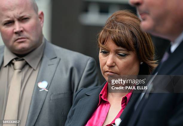 Denise Fergus listens with with her husband Stuart as solicitor Sean Sexton reads a statement after a parole hearing for Jon Venables by video link...