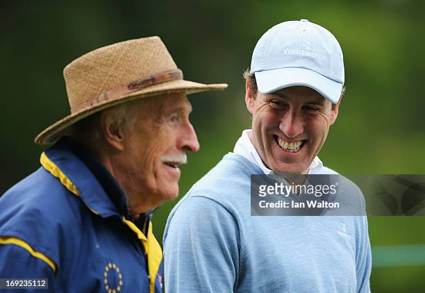Entertainer Sir Bruce Forsyth talks to dancer Anton Du Beke during the Pro-Am round prior to the BMW PGA Championship on the West Course at Wentworth...