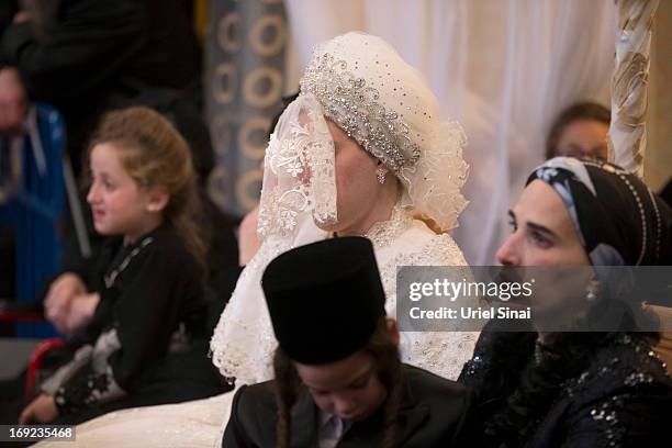 Bride Hannah Batya Penet, during her wedding ceremony to Rabbi Shalom Rokach, the Grandson of the Belz Rabbi, early morrning of May 22, 2013. In...