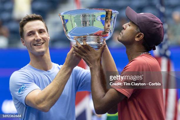 September 8: Joe Salisbury of Great Britain and Rajeev Ram of the United States celebrate with the winner's trophy after their victory in the Men's...