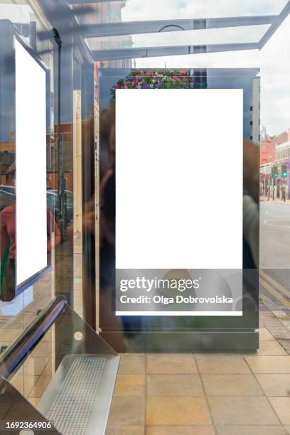 a blank digital ad billboard through the bus stop - bus stop poster stock pictures, royalty-free photos & images