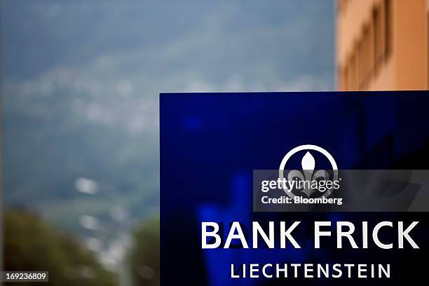 Logo sits on a sign outside the headquarters of Bank Frick & Co. AG in Balzers near Vaduz, Liechtenstein, on Tuesday, May 21, 2013. Liechtenstein, an...