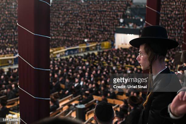 Youth looks on as tens of thousands of Ultra-Orthodox Jews of the Belz Hasidic Dynasty take part in the wedding ceremony of Rabbi Shalom Rokach, the...