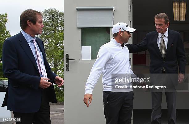 Sergio Garcia of Spain emerges from a meeting in the rules office with George O'Grady, Chief Executive of the European Tour and Tim Finchem, PGA Tour...