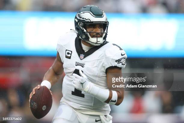 Jalen Hurts of the Philadelphia Eagles runs with the ball against the New England Patriots at Gillette Stadium on September 10, 2023 in Foxborough,...