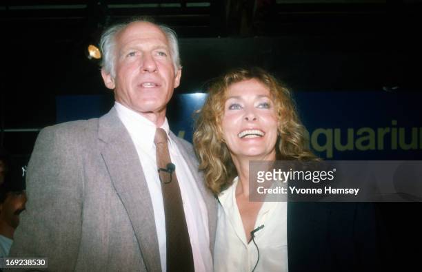 Peter Gimbel and his wife Elga Andersen are photographed August 16, 1984 at the Brooklyn Aquarium in Brooklyn, New York as they wait for the opening...