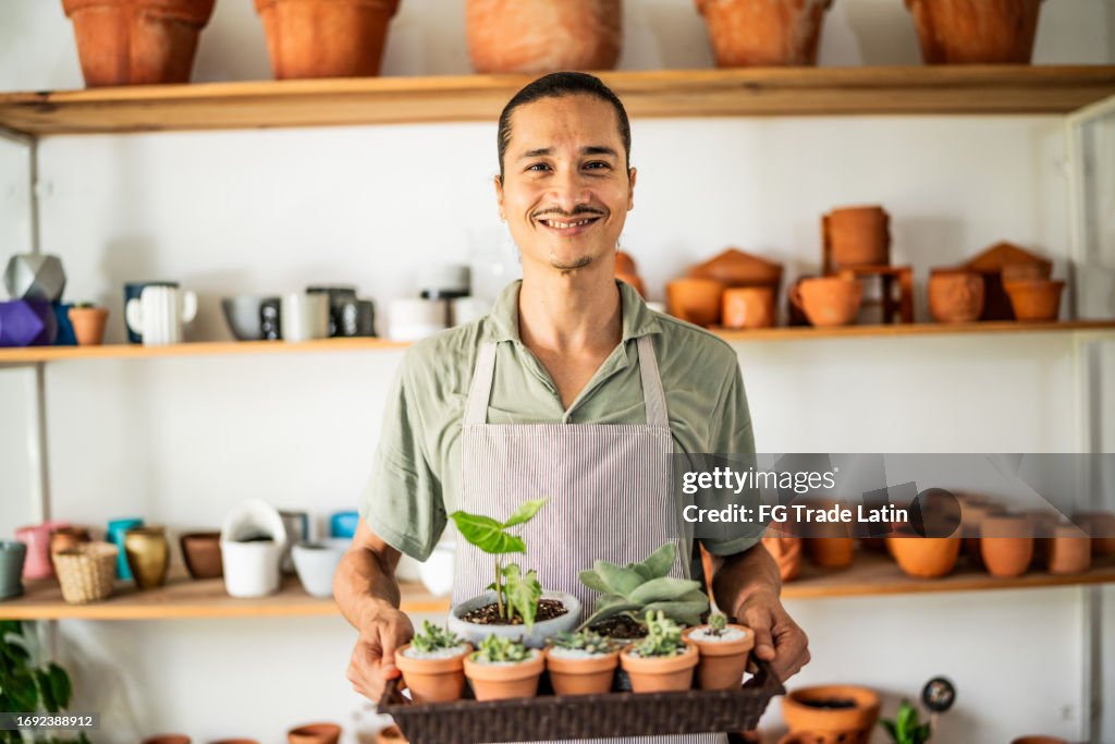 Portrait of a mid adult man at the pottery store