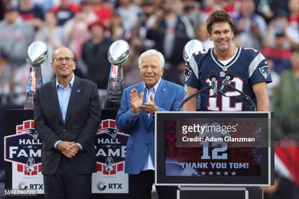 Former New England Patriots quarterback Tom Brady speaks during a halftime ceremony as Patriots President Jonathan Kraft and Patriots owner Robert...