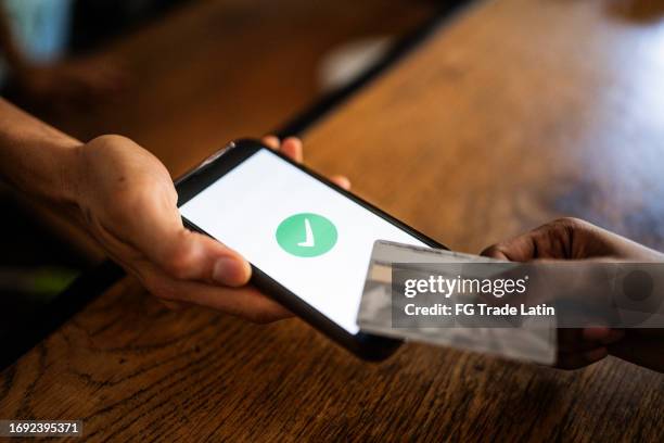 close-up of a contactless payment approved - tap to pay stock pictures, royalty-free photos & images