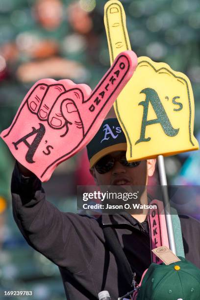 Stadium vendor sells Oakland Athletics merchandise in the stands before the game against the Texas Rangers at O.co Coliseum on May 14, 2013 in...