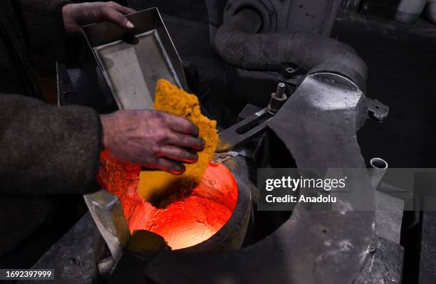 Worker loads raw materials into the oven at Novosibirsk Refining Plant, Russia's leading gold refining and bar manufacturing plant, in Novosibirsk,...