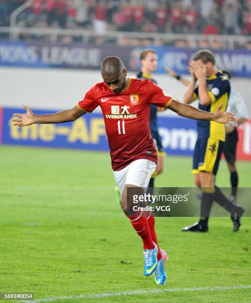 Muriqui of Guangzhou Evergrande celebrates after scoring his team's first goal during the AFC Champions League Round of 16 match between Guangzhou...