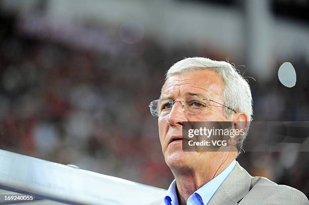 Guangzhou Evergrande head coach Marcello Lippi looks on during the AFC Champions League Round of 16 match between Guangzhou Evergrande and Central...