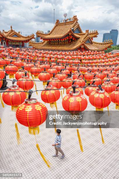 a traveller visiting kuala lumpur's thean hou chinese temple - malaysian culture stock pictures, royalty-free photos & images