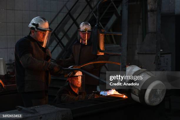 Employees cast ingots of 99.99 percent pure gold at Novosibirsk Refining Plant, Russia's leading gold refining and bar manufacturing plant, in...