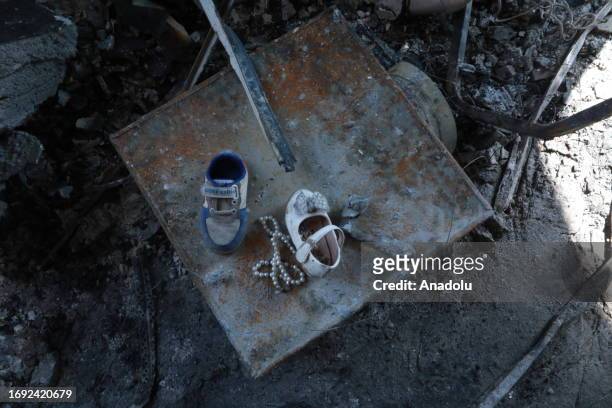 View of the damaged children's shoes on a fire site after a fire broke out at a wedding celebration in the northern Nineveh province in Mosul, Iraq...